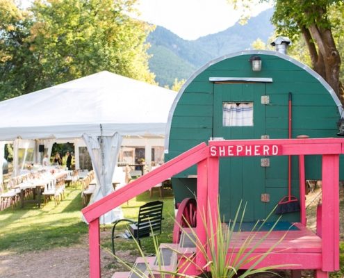 wedding tent-Clear Frame Tent with Farm Tables & X Back Chairs