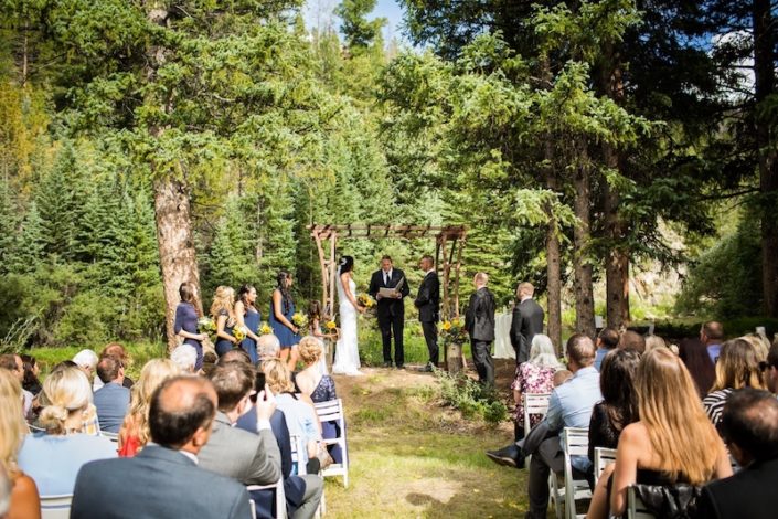 Rustic Iron Wedding Arbor rental & White Garden Resin Ceremony Chairs