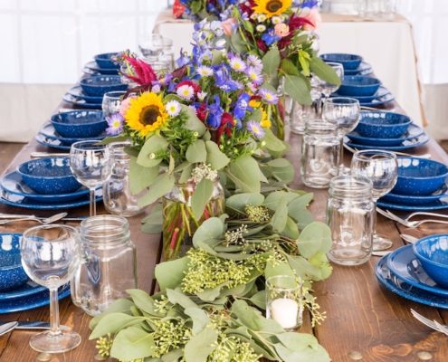Farm Table With Western Blue China, Napa Wine Glasses & Mason Jars