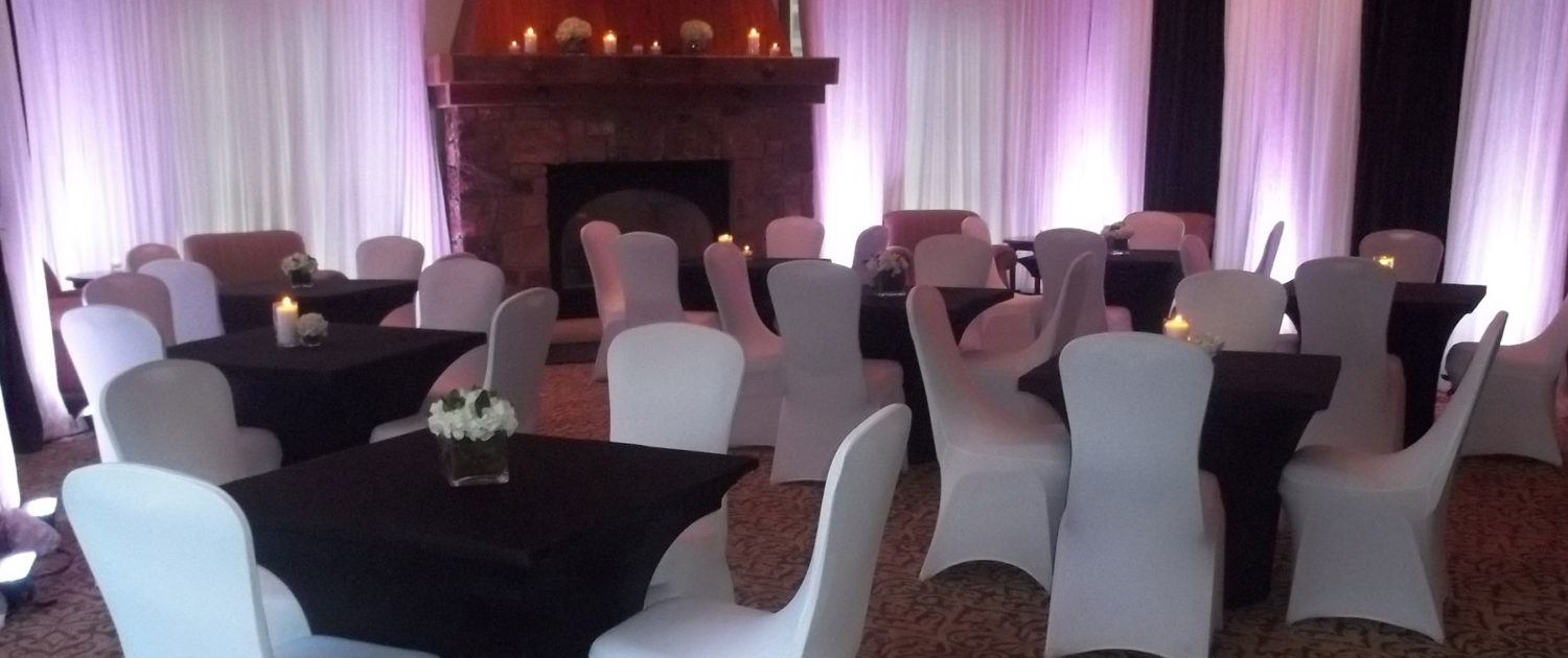 Sheer white pipe and drape with chair covers
