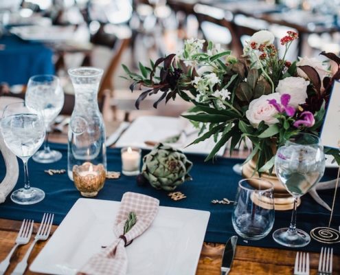 Farm Table With Square Plates, Hammered Flatware, Water Carafs & Stemless Wine Glasses