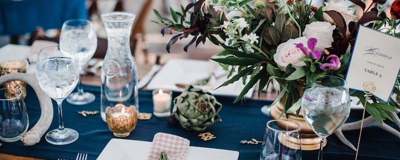 Farm Table With Square Plates, Hammered Flatware, Water Carafs & Stemless Wine Glasses