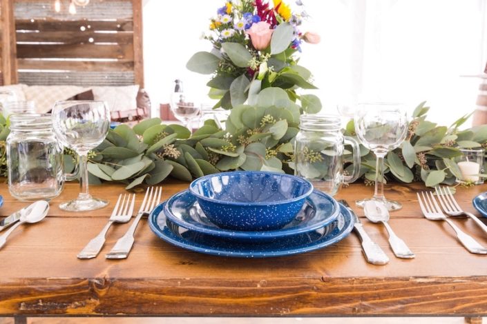 Farm Table With Western Blue China, Hammered Silverware, Napa Wine Glasses & Mason Jars