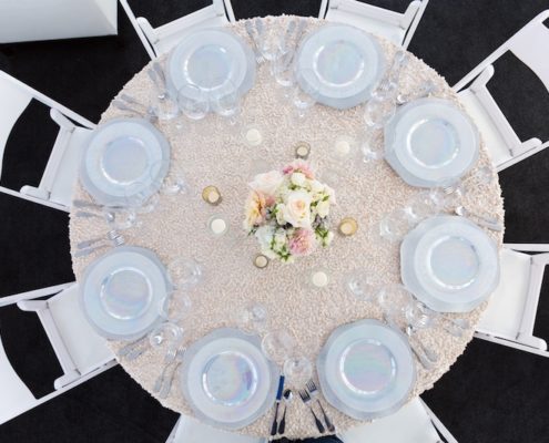 White Padded Wedding Chairs With Luster China, Hammered wedding silverware rental & Black Astro Turf