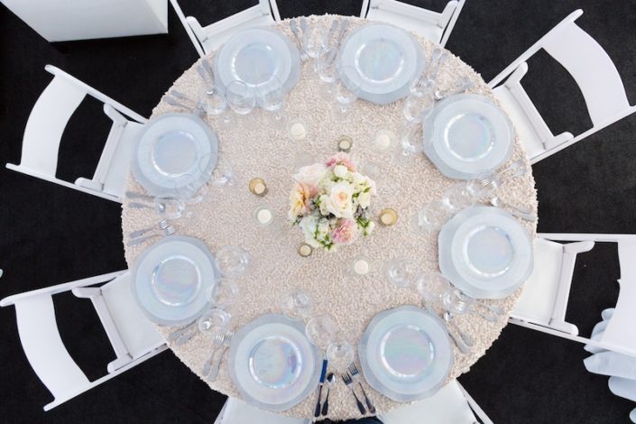 White Padded Wedding Chairs With Luster China, Hammered wedding silverware rental & Black Astro Turf