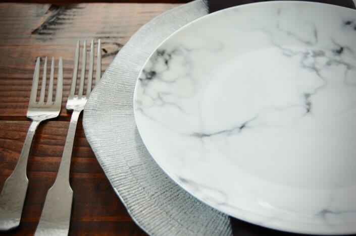 china rental- marble plate silver charger with hammered flatware