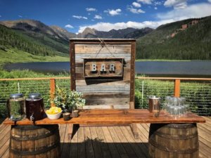 Whiskey Barrel Bar with Rustic Bar Sign- Piney River Ranch Corporate Event