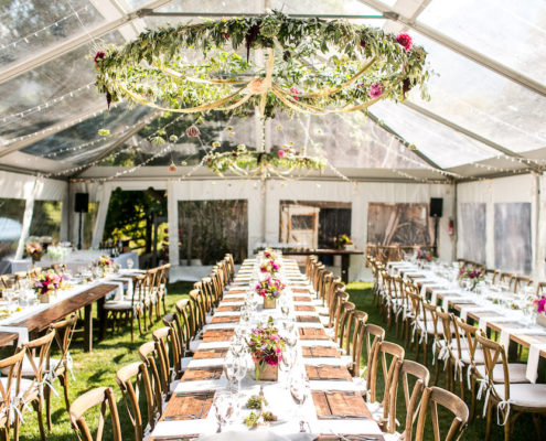 Clear Wedding Tent and Farm Tables Summer Colorado Wedding at Avalanche Ranch Hot Springs