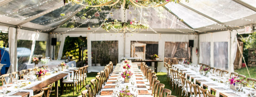 Clear Wedding Tent and Farm Tables Summer Colorado Wedding at Avalanche Ranch Hot Springs