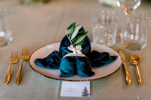 Blue velvet napkins with brushed gold flatware - Colorado Wedding Rentals