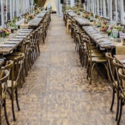 Rustic Farm Tables & X Back Chairs in Wedding Tent