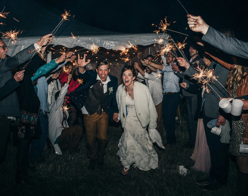 Bride and Groom Leaving Red Sky Ranch Fall Wedding in Breckenridge