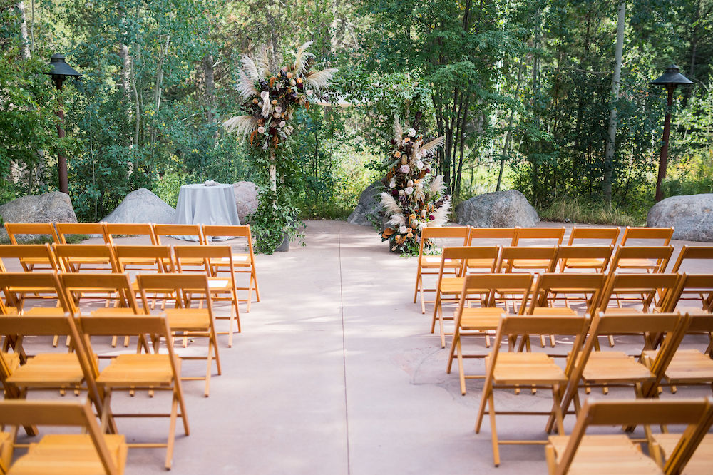 back patio chairs and arch - nate and jenny weddings
