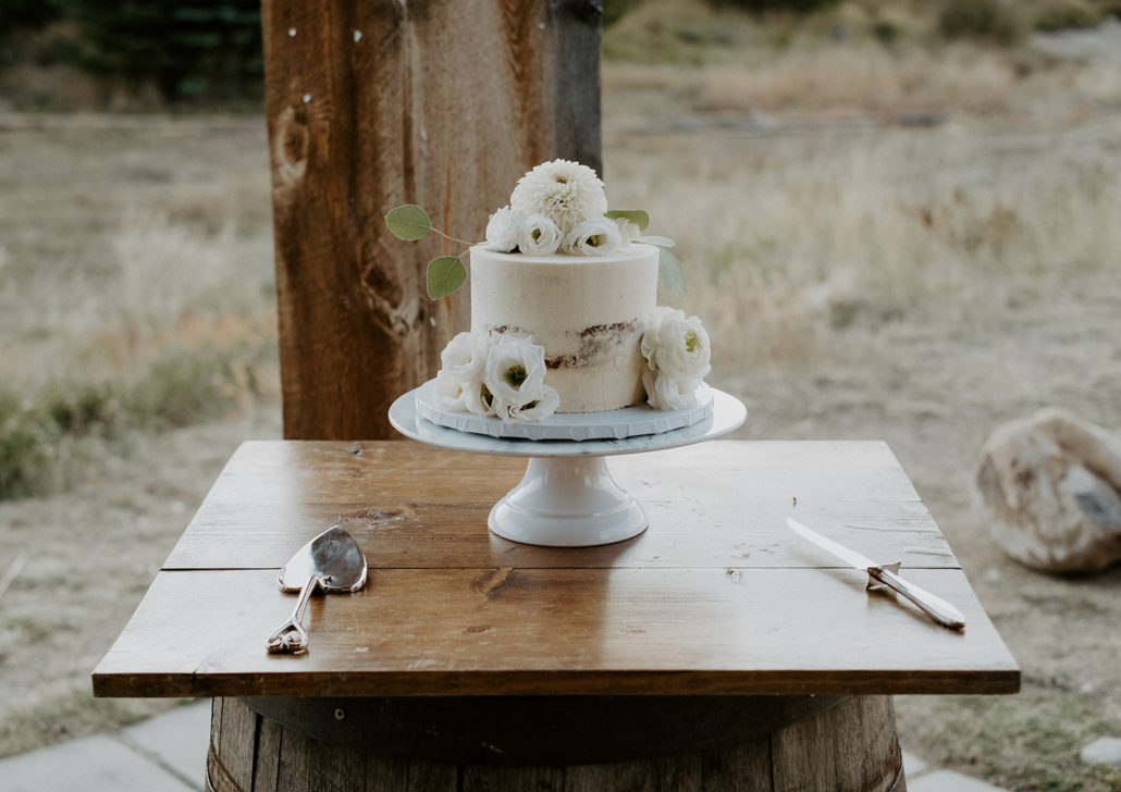 wedding cake on whiskey barrel table