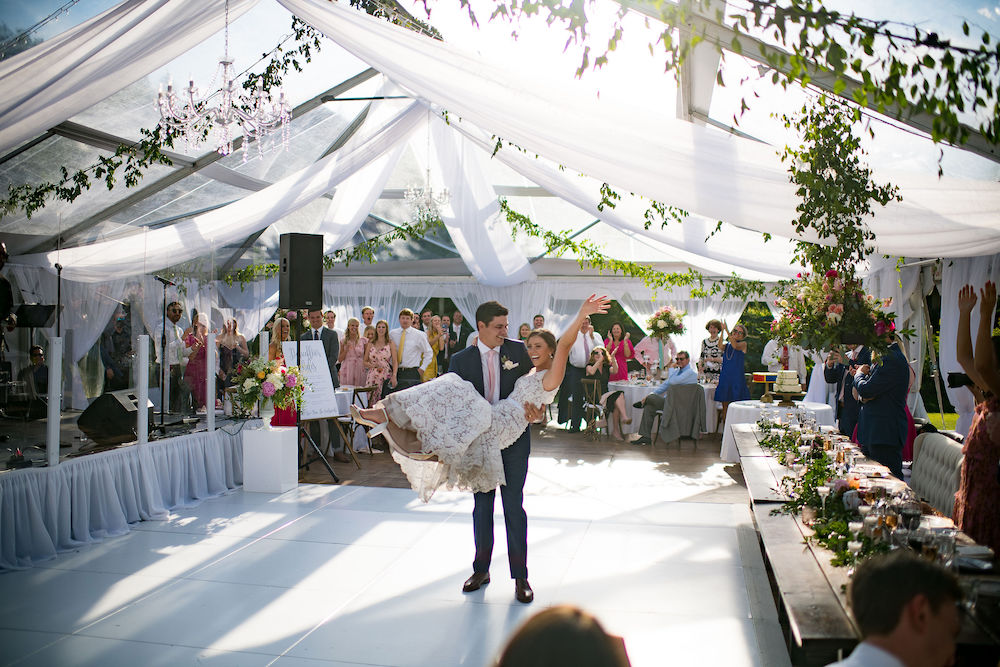 Clear wedding tent in Vail, Colorado with bride and groom