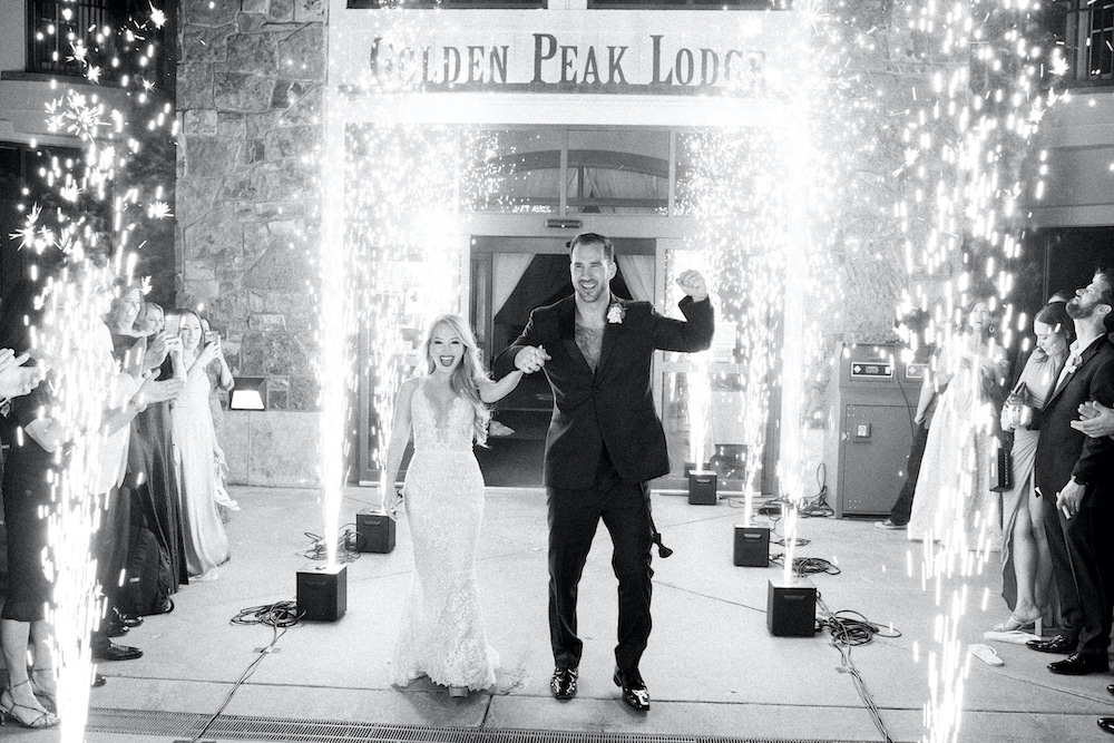 Vail wedding exit bride and groom in black and white at Golden Peak Lodge