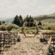 Boho colorado wedding ceremony with x back chairs