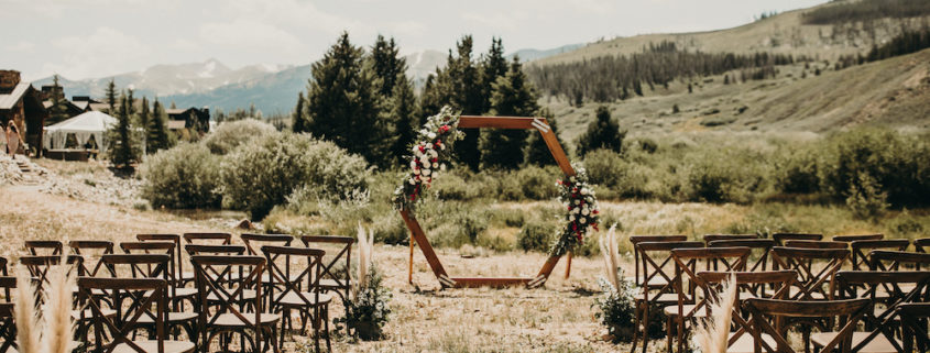 Boho colorado wedding ceremony with x back chairs