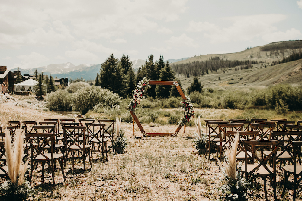 Boho colorado wedding ceremony with x back chairs