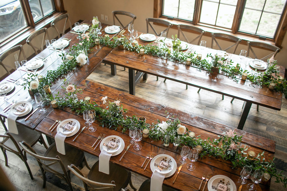 large farm table wedding table setup in Colorado Rocky Mountains