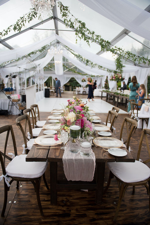 X back farm chairs with white pads and farm table in clear Vail wedding tent